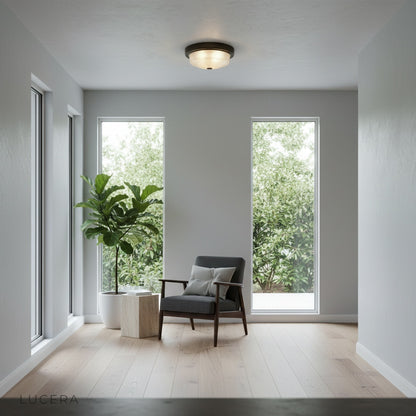 Veneration ceiling light in bright reading nook with frosted glass casting even illumination over armchair