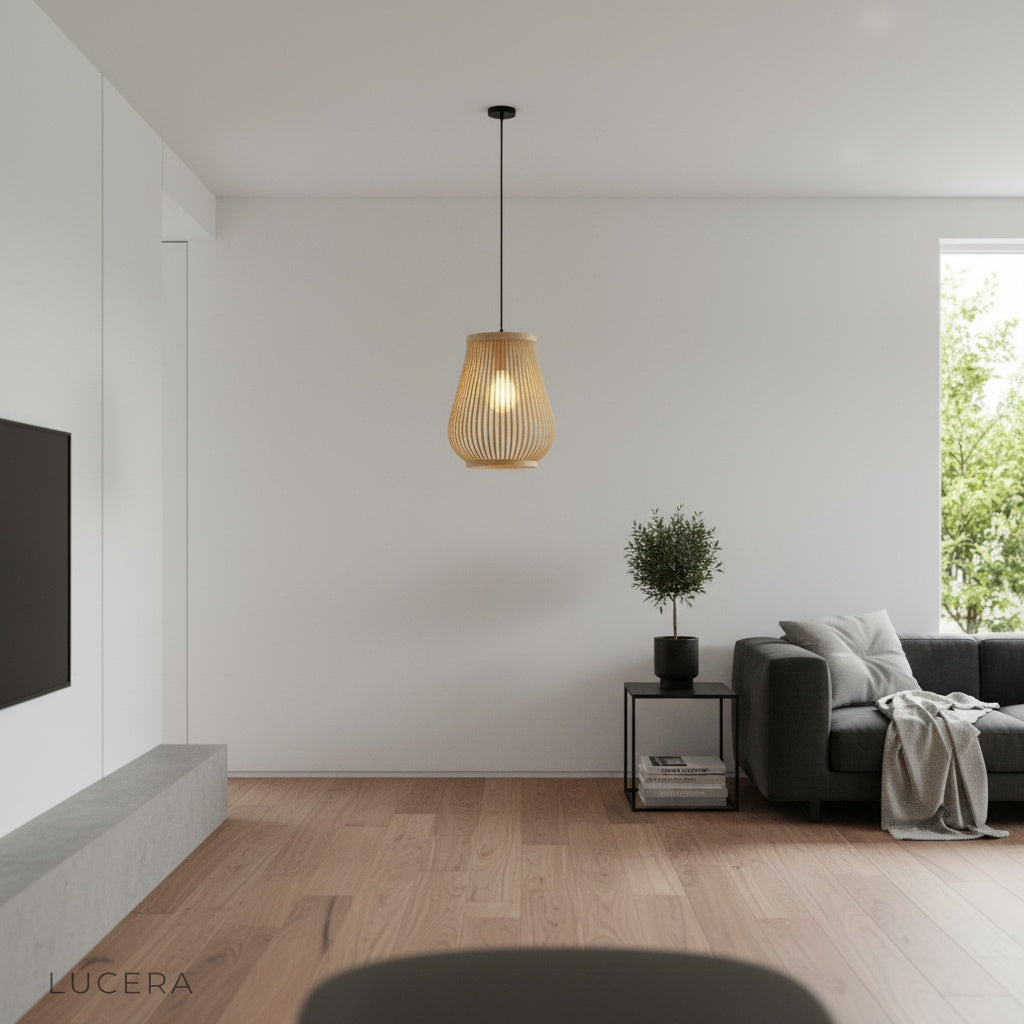 evening shot of woven bamboo lamp glowing warmly against dark interior wall