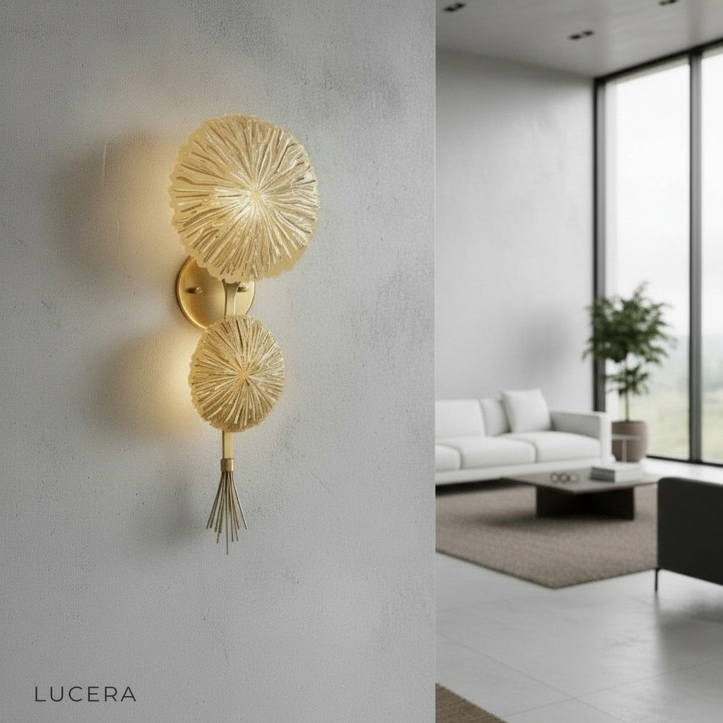 Sacro lamp glowing in hallway niche with gold finish casting patterned light on wall