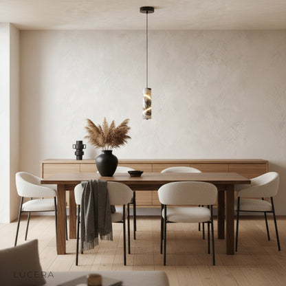 Zest pendant light illuminating a dining table with two chairs in a bright contemporary space