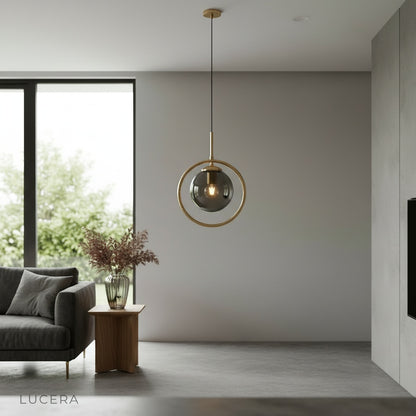 Caelus pendant light in a high-ceiling entryway with dramatic shadows and warm glow