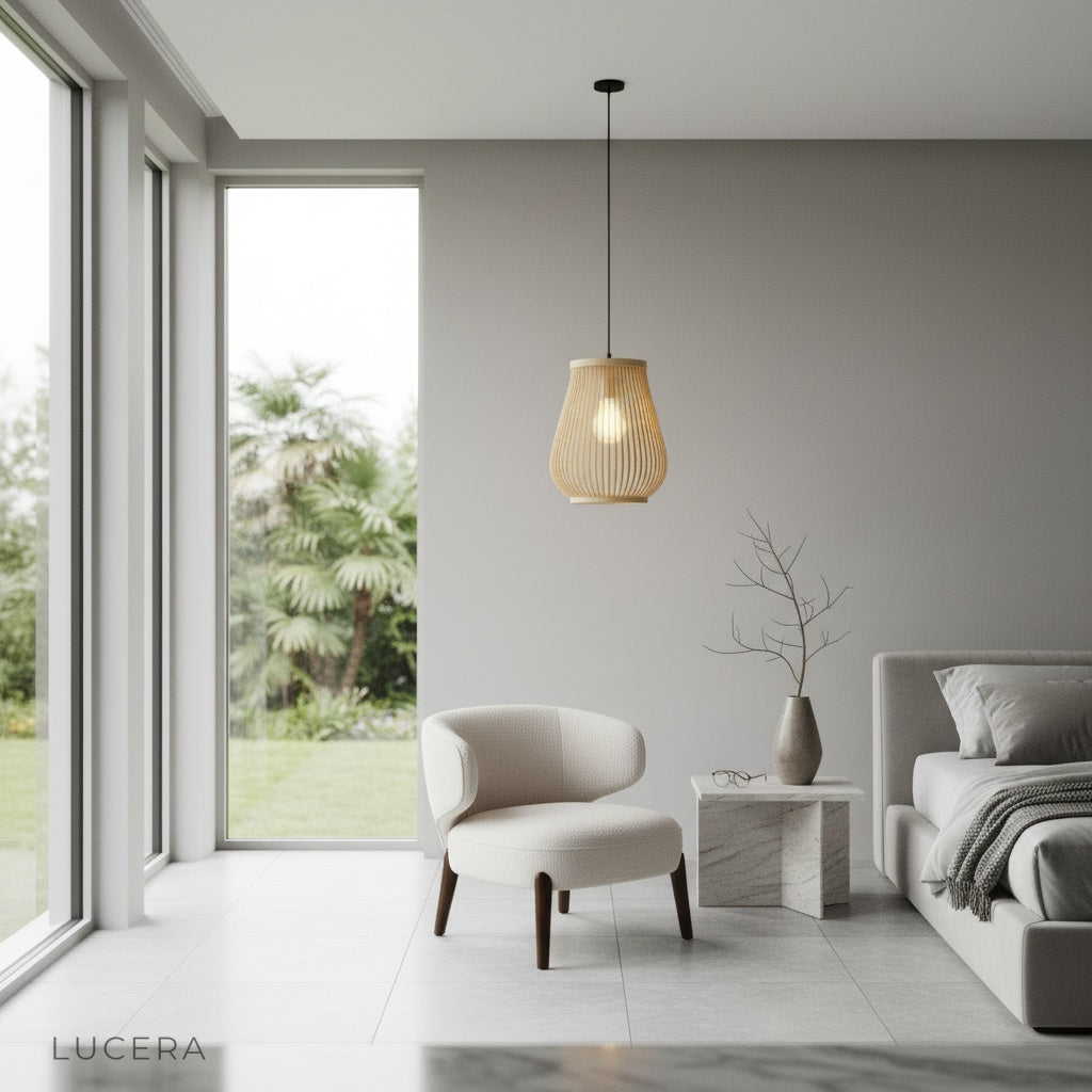trio of rattan pendant lights in varied sizes creating layered lighting in open concept space