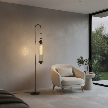 Sacrament Floor Lamp casting soft ambient light in cozy reading corner at dusk