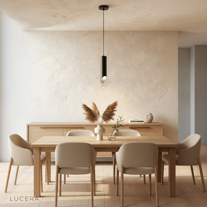 Winifred pendant light hanging above bedside table in minimalist bedroom at night