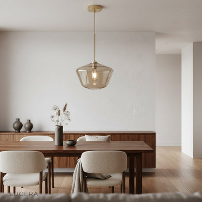 nighttime shot of Sake pendant light in modern hallway with brass accents