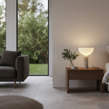 Tristan Table Lamp glowing softly on wooden office desk in ambient evening light