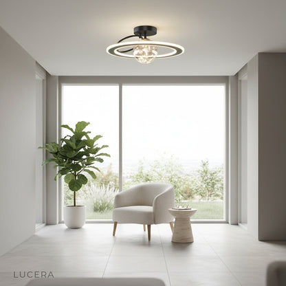 Gadroon ceiling light at night casting ambient light over cozy seating corner