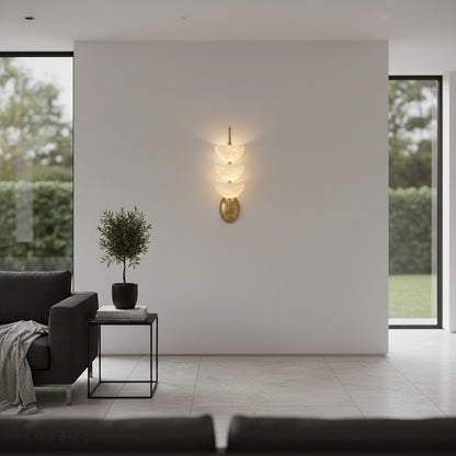 Kiel Wall Lamp illuminating a classic living room corner at dusk