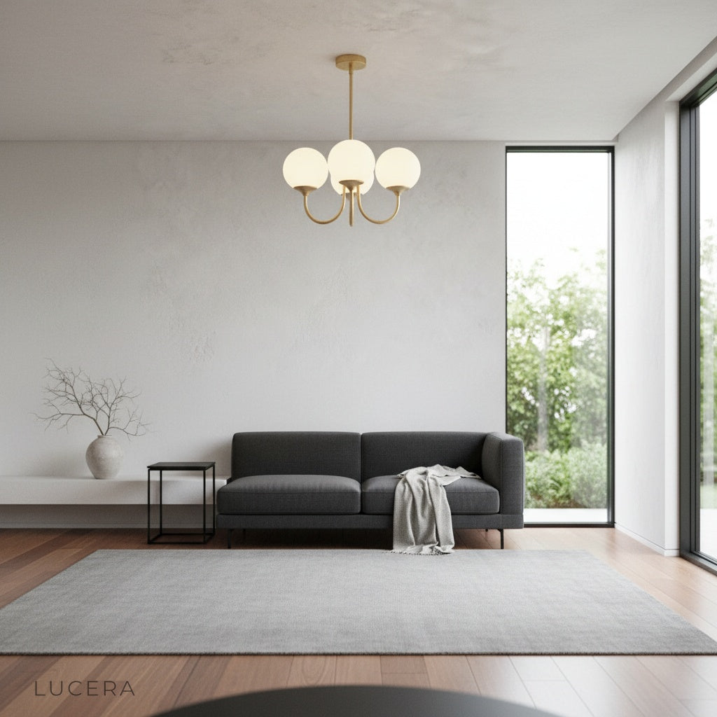 Urbain chandelier glowing warmly in a dining room with ambient evening light