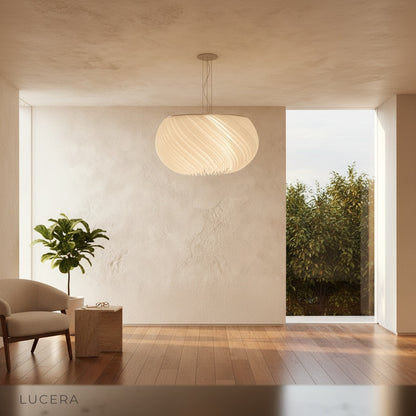 Theron chandelier side profile in bright studio showing layered white materials