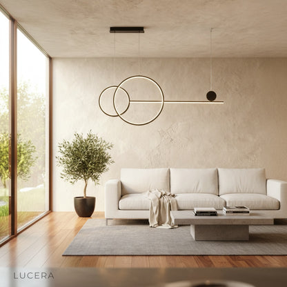 Brumal pendant light gold finish in cozy reading nook with warm lighting