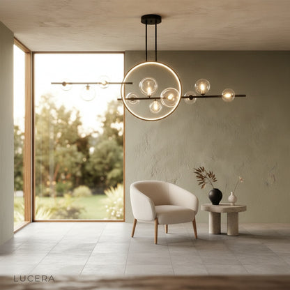 Zona chandelier glowing at dusk in minimalist bedroom with adjustable hanging wire