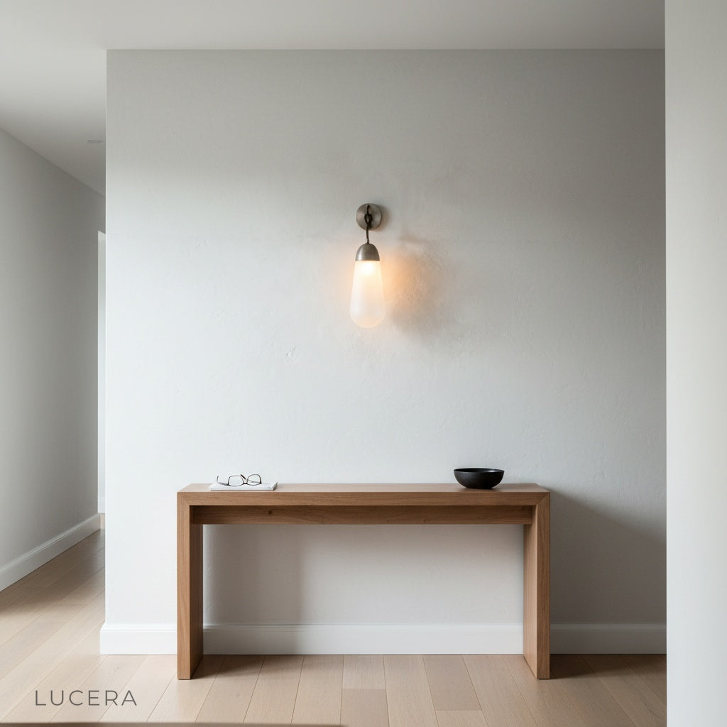 warm ambient glow from copper sconce lighting a hallway at dusk