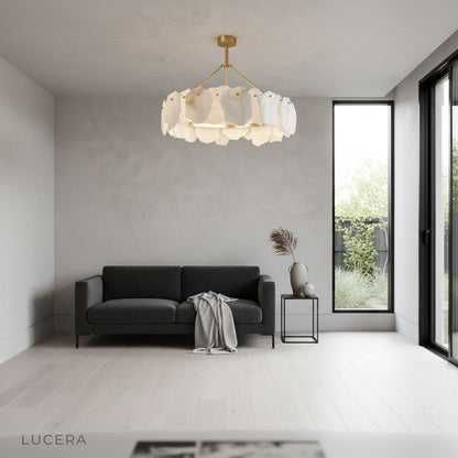 Nighttime lifestyle shot of alabaster chandelier illuminating entryway