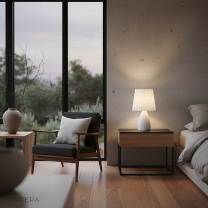 Wistful Table Lamp glowing warm light on wooden shelf in cozy reading nook