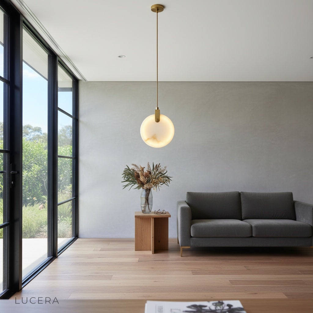 alabaster pendant light illuminating dining area with warm glow