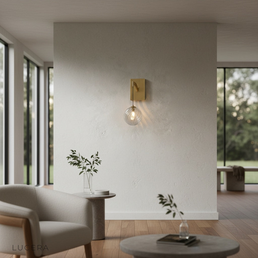 elegant copper wall light with glass shade in cozy reading corner