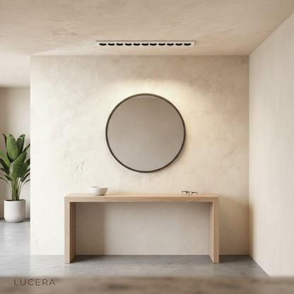close-up of Knoll downlight deep-set black reflector minimizing glare in bright ceiling