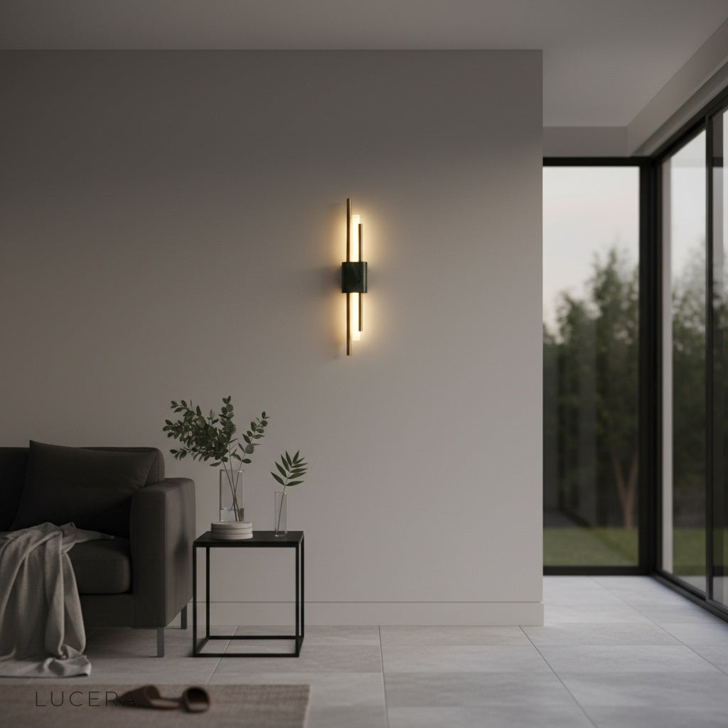 Xyloid wall lamp above bathroom vanity with marble tile and warm reflection