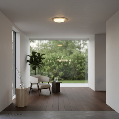 round travertine and marble pendant lamp illuminating modern entryway