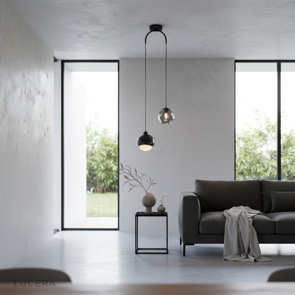 Black Vale pendant light above an entryway console, ambient warm lighting, stylish home