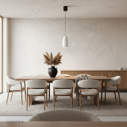 capsule pendant light over a sleek kitchen island with warm accent lighting