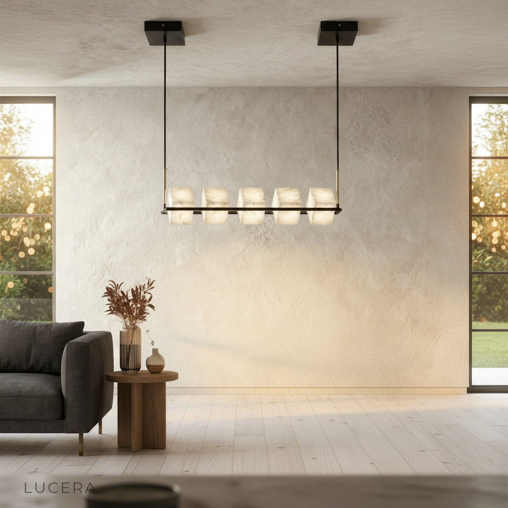 Locket Chandelier in ambient evening light casting warm shadows over minimalist dining room
