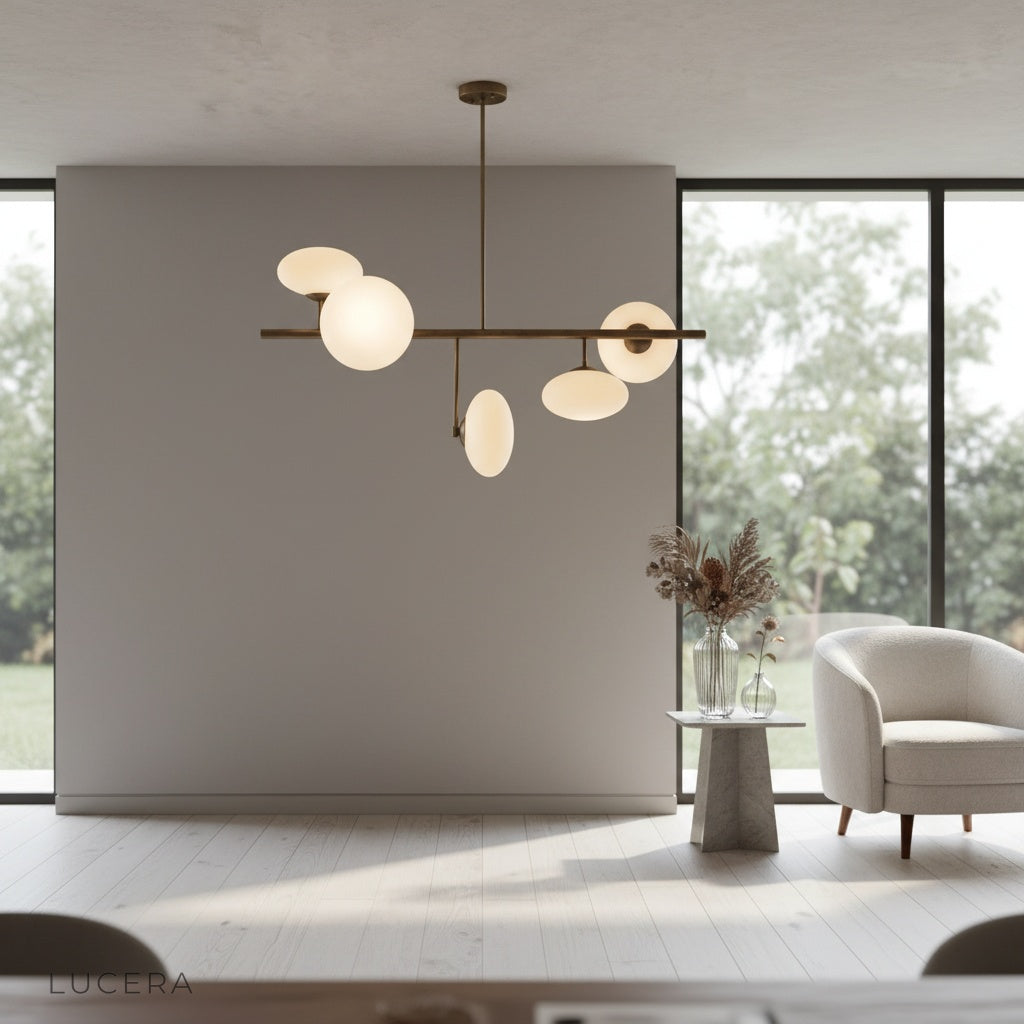 Naples Yellow Chandelier above modern console table in hallway with soft shadows