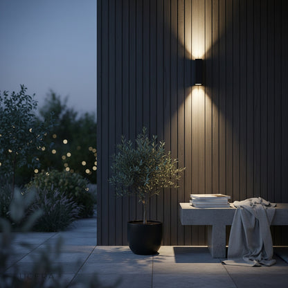 gold wall lamp highlighting architectural wall panel in stylish lounge