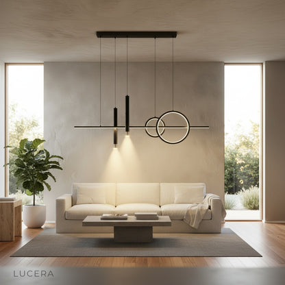 Nighttime lifestyle shot of Trim Pendant Light illuminating a stylish office desk with books