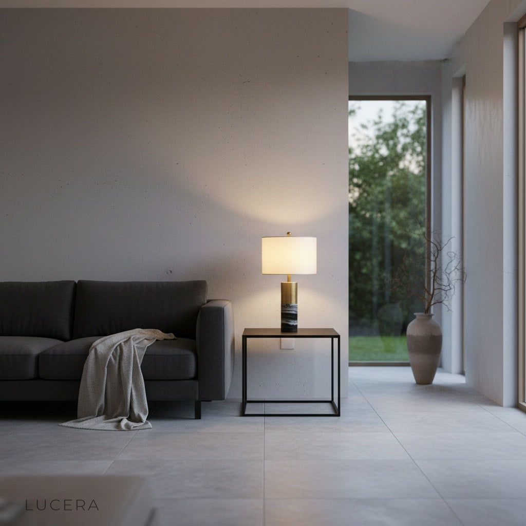 Essere Table Lamp illuminated at dusk on console table in contemporary hallway with textured wall