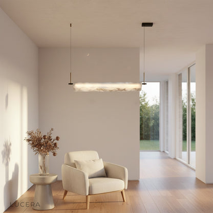 Lucera pendant light suspended above a bedside table in a serene bedroom setting