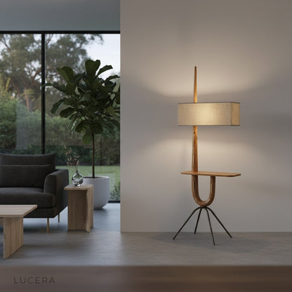 close-up of Uva lamp's integrated side table holding a book and coffee cup