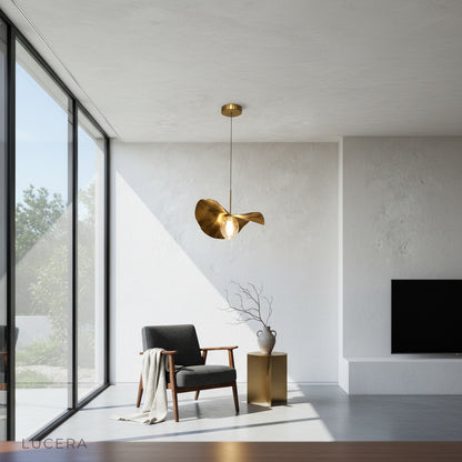 Adjustable cord pendant light styled in bright kitchen with white cabinetry