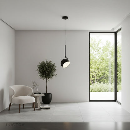 Sancerre pendant light glowing warmly in an ambient evening living room setting
