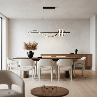 Ulysse chandelier emitting warm ambient light in cozy bedroom at night