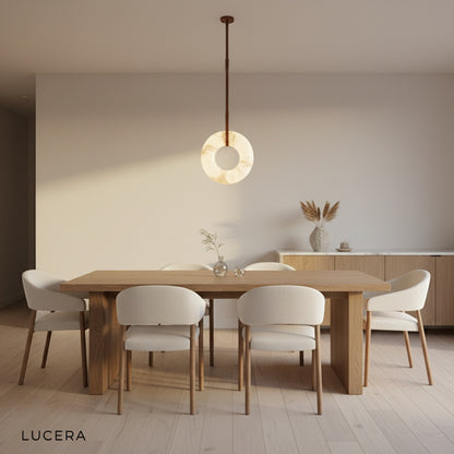 Helix alabaster pendant light with leather straps in elegant hallway with high ceiling and wood floor