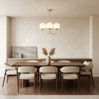 Urbain chandelier with peachy pink shades illuminating a modern office space