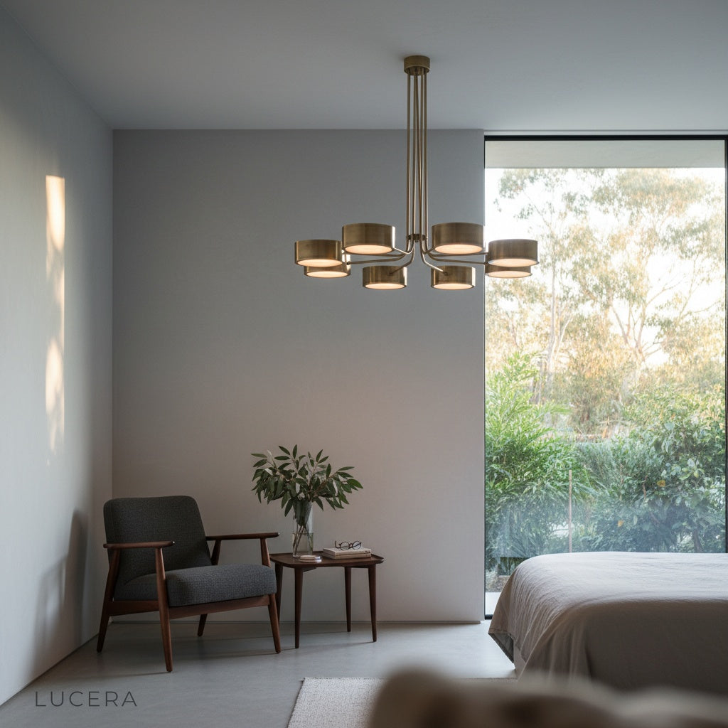 evening ambiance shot of Lacrima brass chandelier in a minimalist lounge