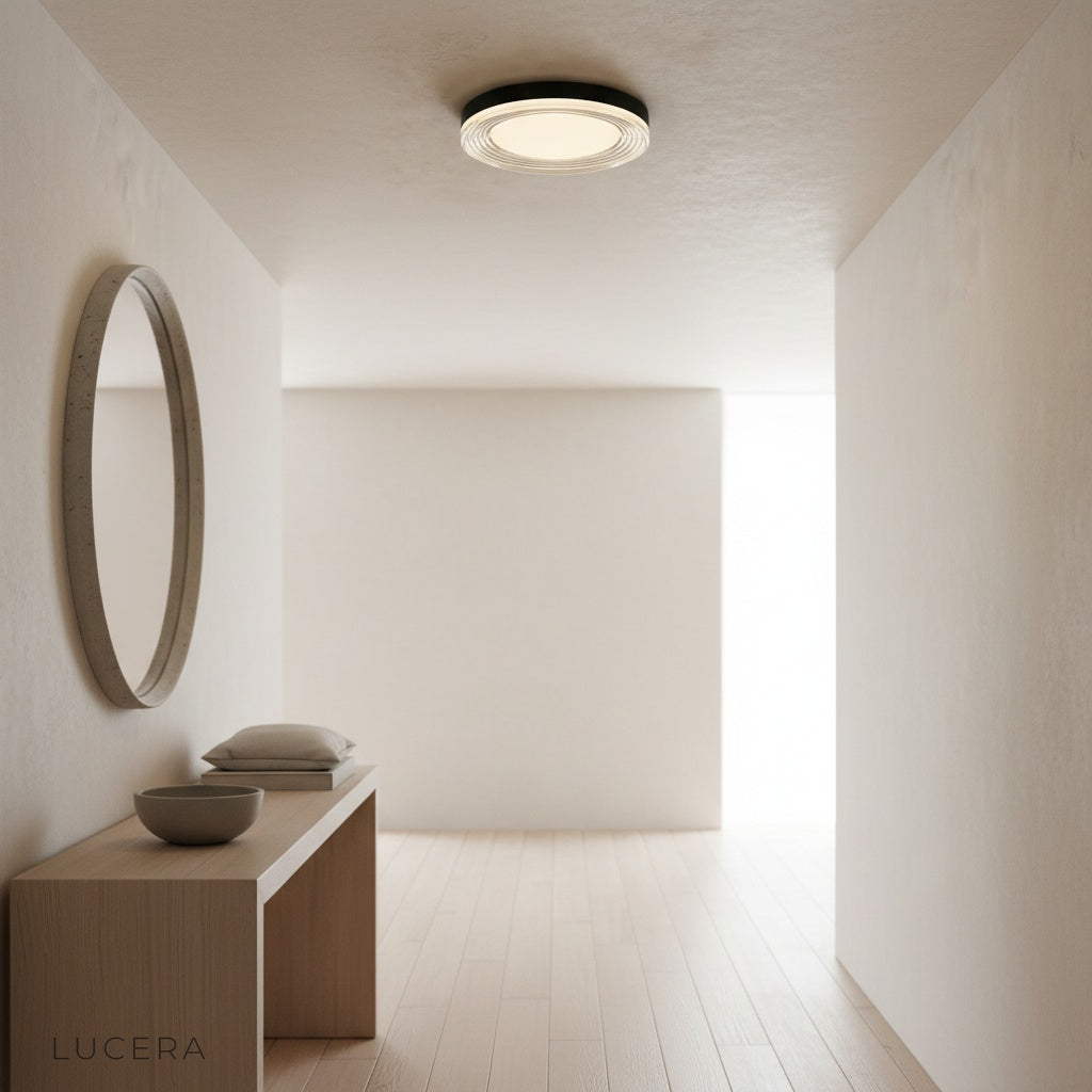 nighttime hallway lit by sleek black and acrylic ceiling light
