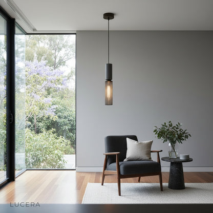 Nighttime lifestyle shot of Ridge Pendant Light illuminating a rustic wooden table with soft patterned shadows