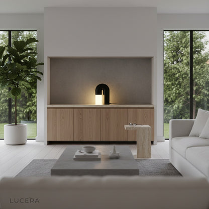 Nighttime Vigil Table Lamp casting warm light on linen armchair in reading corner