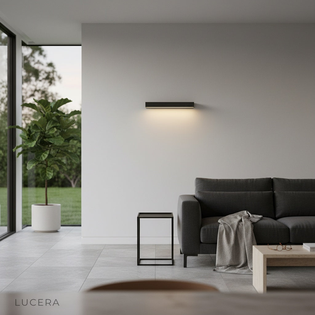 Goccia wall lamp as nightlight on modern stucco wall, moonlit garden background