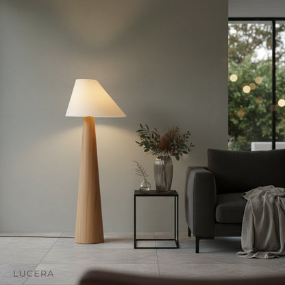 nighttime lifestyle shot of Lucera garden floor lamp glowing in outdoor terrace