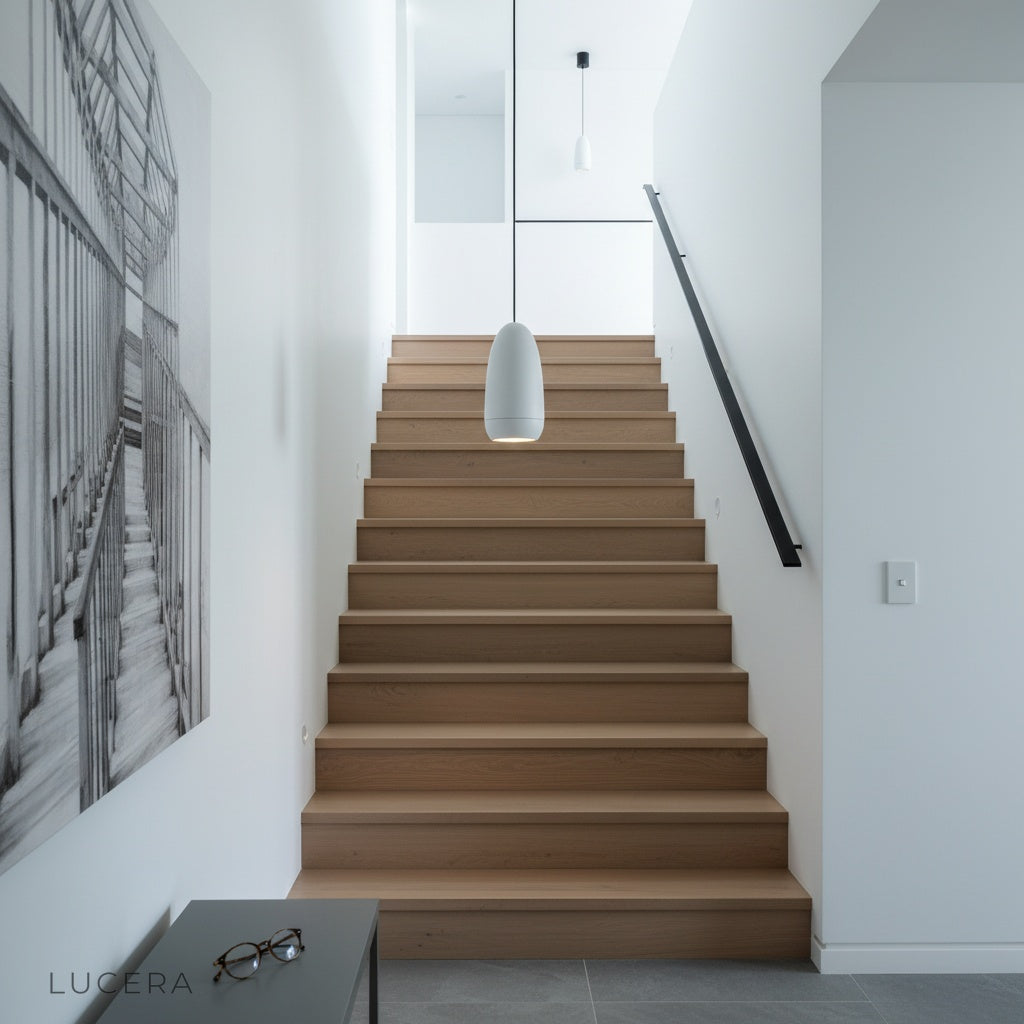 nighttime lifestyle view of capsule pendant lights adding depth to a contemporary living room