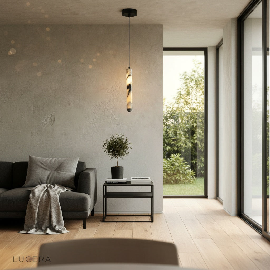 hypnotic marble pendant light suspended in a contemporary lounge with floor-to-ceiling windows at dusk