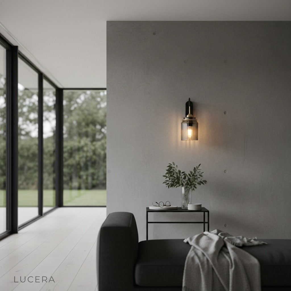 Festa wall lamp illuminated at dusk in a stylish living room with elegant curved arm