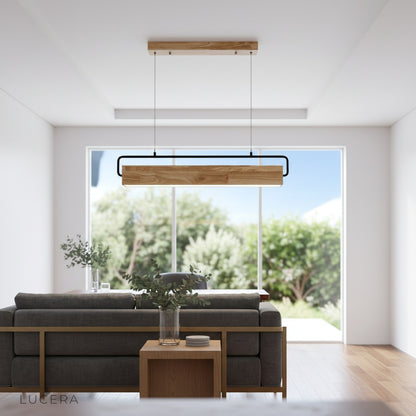 Bravura pendant light glowing warmly in a cozy kitchen at night with rustic modern decor