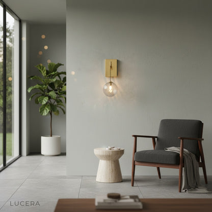 wall lamp with warm ambient glow above modern sofa at night