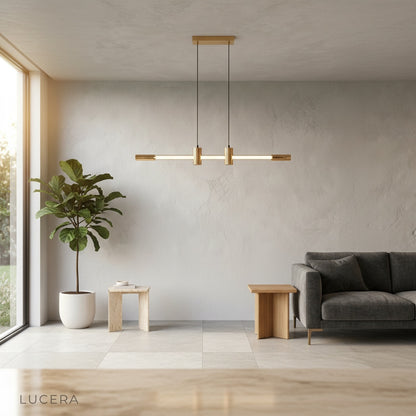 Gideon pendant light glowing at night in a chic bedroom corner with elegant brass accents